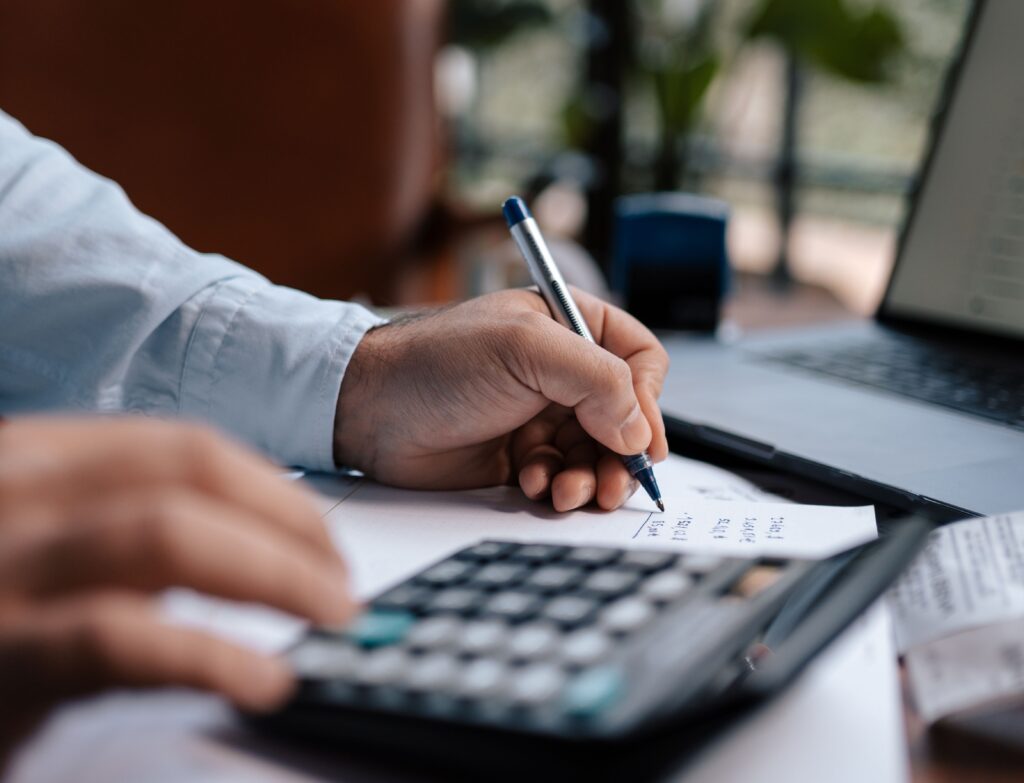 Photo by Mohamed hamdi: https://www.pexels.com/photo/a-person-using-a-calculator-16282306/
